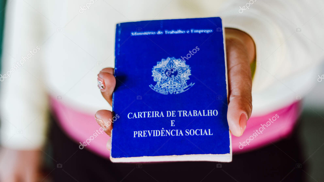 July 4, 2020, Brazil. Woman holds his Brazilian document work and social security (Carteira de Trabalho e Previdencia Social)